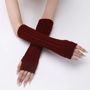 Detail of burgundy cable knit fingerless gloves showing the textured pattern and arm coverage