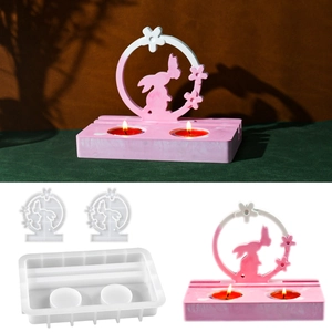Macro view of silicone molds for oval candle holders with rabbit wreath craft details