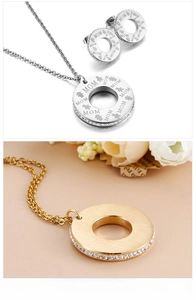 Detail of MOM letter engraving on circle pendant and earrings with zircon inlay