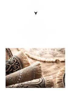 Detail showing the woven texture and black geometric patterns of a jute placemat with tassels