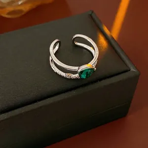 Silver-toned double layer open ring with pear-cut green stone and micro-pave zircons