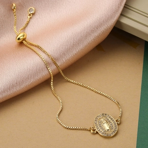 Detail of 18K gold Virgin Mary bolo bracelet with sparkling pave zircon settings
