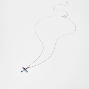 Macro detail of S925 silver necklace with colorful zircon gemstones in a cross pendant