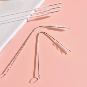 304 stainless steel baby bottle straw cleaning brush set with white bristles on pink background