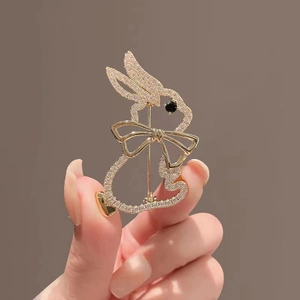 Exquisite golden rabbit brooch with sparkling crystals and mother of pearl inlay for suits