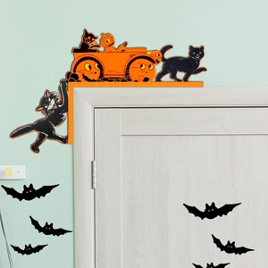 Detail of vintage Halloween wooden door corner decor with black cat and bat silhouettes