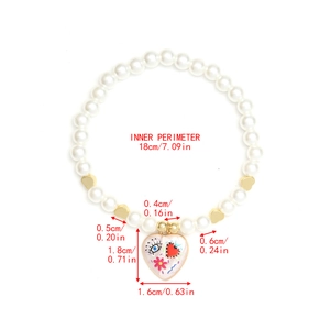 Detailed view of faux pearl bracelet with evil eye heart pendant and dimensions