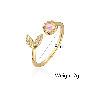 Detail of fishtail open ring in 18K gold plating with pink zircon and white stones