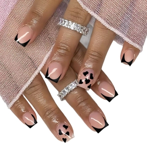 Classic French medium square press-on nails with black tips and heart patterns