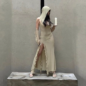Detail view of a slim-fit slit dress with elegant ruffled sleeves and a hood in beige