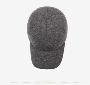 Top view of dark grey wool blend baseball cap with structured panels and metal logo detail