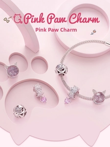 Detailed view of S925 sterling silver pink paw heart charms on a snake chain bracelet