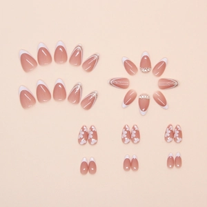 Detailed press-on nails set with french tips, floral art, glitter and pearls