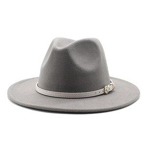 Detail of gray wool fedora hat featuring a white leather band and gold buckle accent