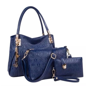 Blue 3-piece embossed tote bag set with crossbody, clutch and butterfly charm pendant