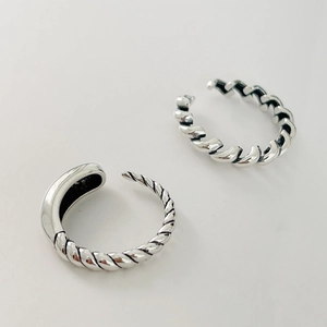 Detail shot of vintage silver open ring with twisted rope texture and adjustable band