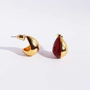 Elegant gold and dark red enamel waterdrop earrings in a minimalist teardrop crescent shape