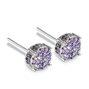 Close-up of silver-plated stud earrings with sparkling purple round-cut cubic zirconia