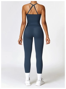 Rear view of high-waisted yoga pants with butt-lifting seam and cross-back sports bra