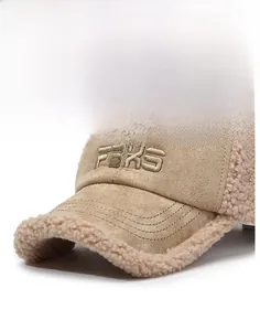 Detailed macro view of khaki fleece baseball cap with FBKS embroidery and suede front
