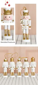 Close-up of 13cm white and gold wooden nutcracker soldier with intricate holiday details