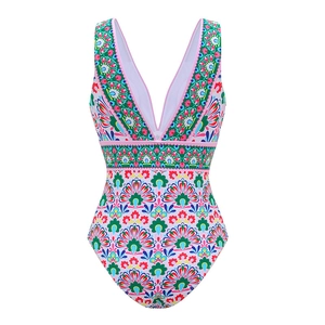 Close-up of women's modest one-piece swimsuit with colorful ethnic mandala floral print