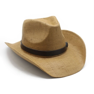 Detail of hand-woven straw texture and leather band on a western cowboy hat