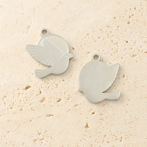 Polished stainless steel peace dove pendants with detailed wing engraving and smooth back