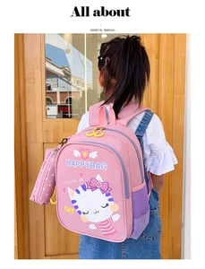 Detailed view of pink toddler backpack featuring cute cartoon cat print and side mesh pocket