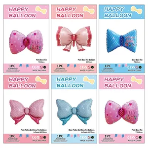 Polka dot bow foil balloons in pink and blue for baby birthday party decorations