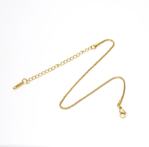 Detail of gold-plated stainless steel anklet with lobster clasp and extension chain