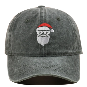 Close-up of Santa Claus embroidery on a washed grey vintage cotton baseball cap