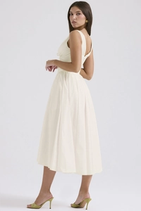 Detailed back view of sleeveless V-neck backless ivory midi dress with pleated skirt
