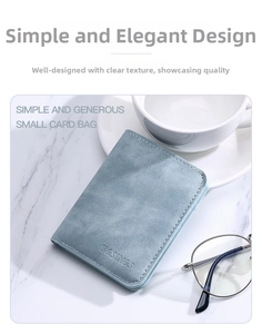 Slim light blue card holder with retro texture and neat stitching on marble surface