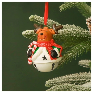 Detail of reindeer Christmas ornament with red scarf on a pine branch with white metal bell