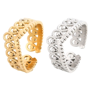 Detail of adjustable hollow crown rings in gold and silver with vintage bead edge design