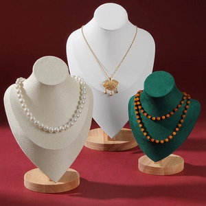 Solid wood bust necklace displays with premium velvet upholstery in cream and dark green