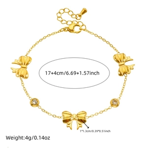 Gold stainless steel bow bracelet with zircon stones and length measurements