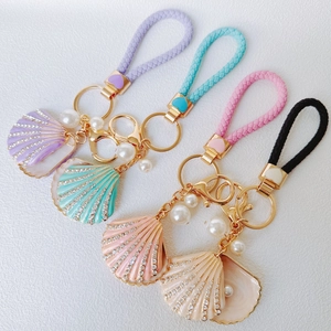 Chic rhinestone shell and pearl keychains with braided PU straps in four pastel colors