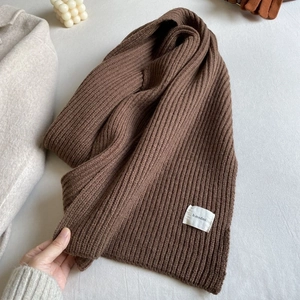 Thick brown ribbed knit scarf for winter warmth with a soft textured minimalist design