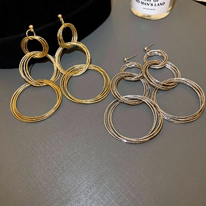 Minimalist layered geometric metal earrings in gold and silver with hammer texture finish