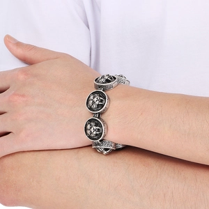 Vintage oxidized silver tiger head bracelet for men featuring a textured curb chain