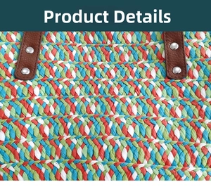 Detail of colorful woven straw bag featuring leather handle with silver metal rivets