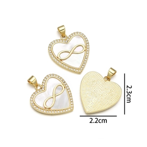 Detail view of heart pendant with shell inlay, infinity symbol and sparkling stones