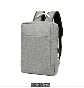 Side view of gray travel laptop backpack with built-in USB charging port and metal handle