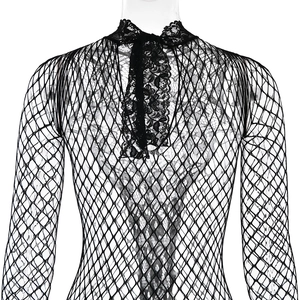 Close-up of black mesh bodysuit with intricate lace high neck and glittering rhinestones