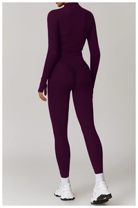 Detail of plum purple high-waist yoga leggings featuring scrunch butt design for lifting