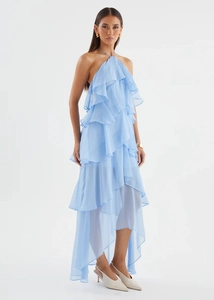 Detailed view of light blue tiered ruffle dress with halter neck and chiffon layers