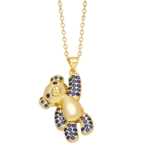Charming gold teddy bear pendant necklace with blue pavé crystals on a delicate chain