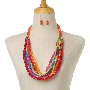 Colorful multi-layer faux pearl necklace and orange earrings set on mannequin